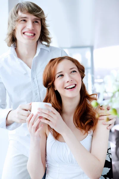 Young couple with a gift — Stock Photo, Image