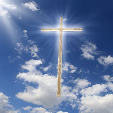 Christian cross against the sky clipart