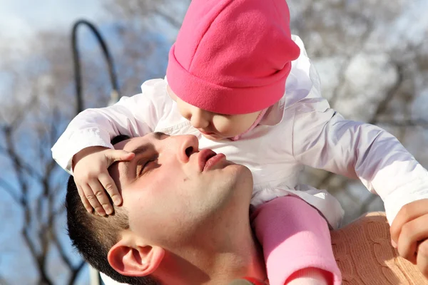 Litlle girl with father outdoors — Stock Photo, Image