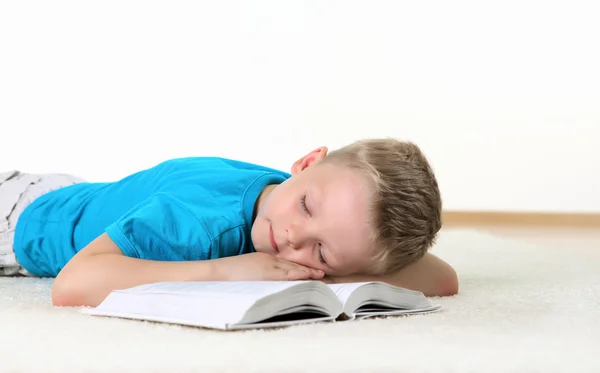 Little boy with a book in studio — Stock Photo, Image
