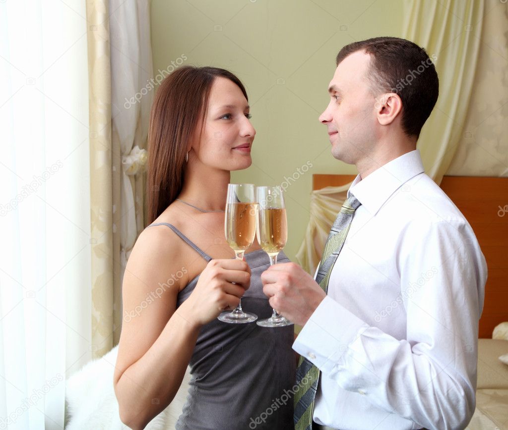 Young couple with glasses of champagne
