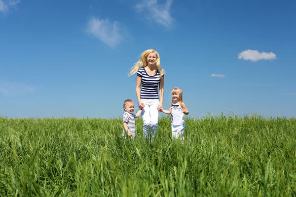 Mother with her children outdoors — Stock Photo, Image