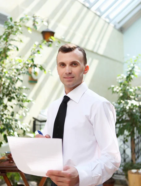 Young businessman in the garden — Stock Photo, Image