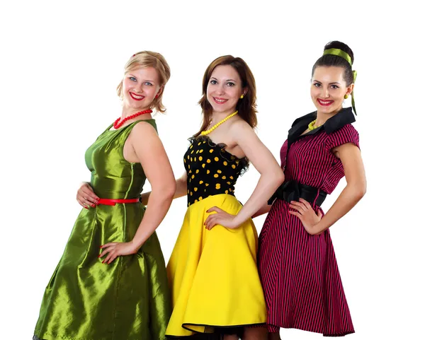 Three young woman in bright colour dresses — Stock Photo, Image