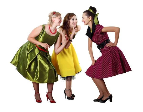 Three young woman in bright colour dresses — Stock Photo, Image