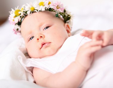 Portrait of a baby with a wreath clipart