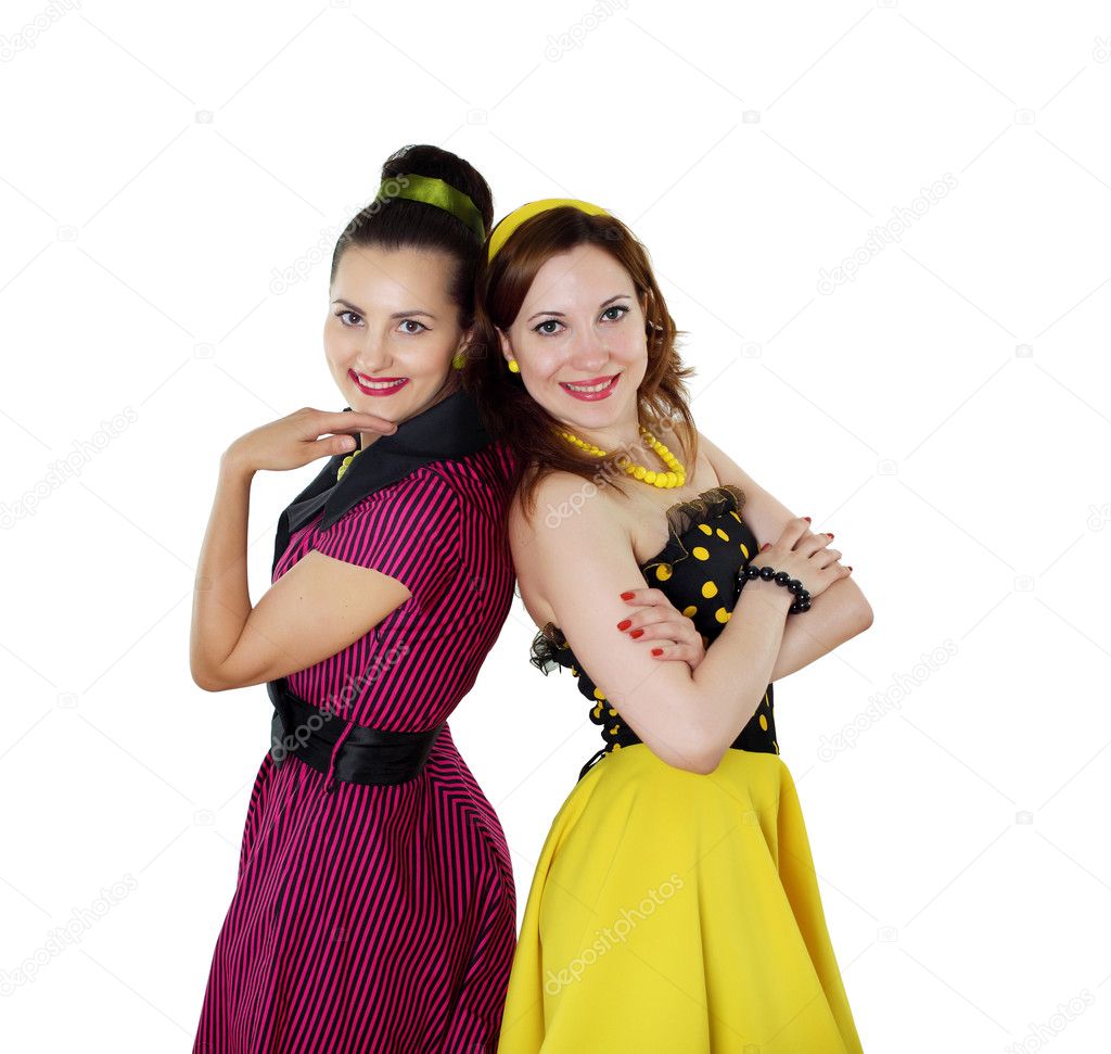 Two young woman in bright colour dresses