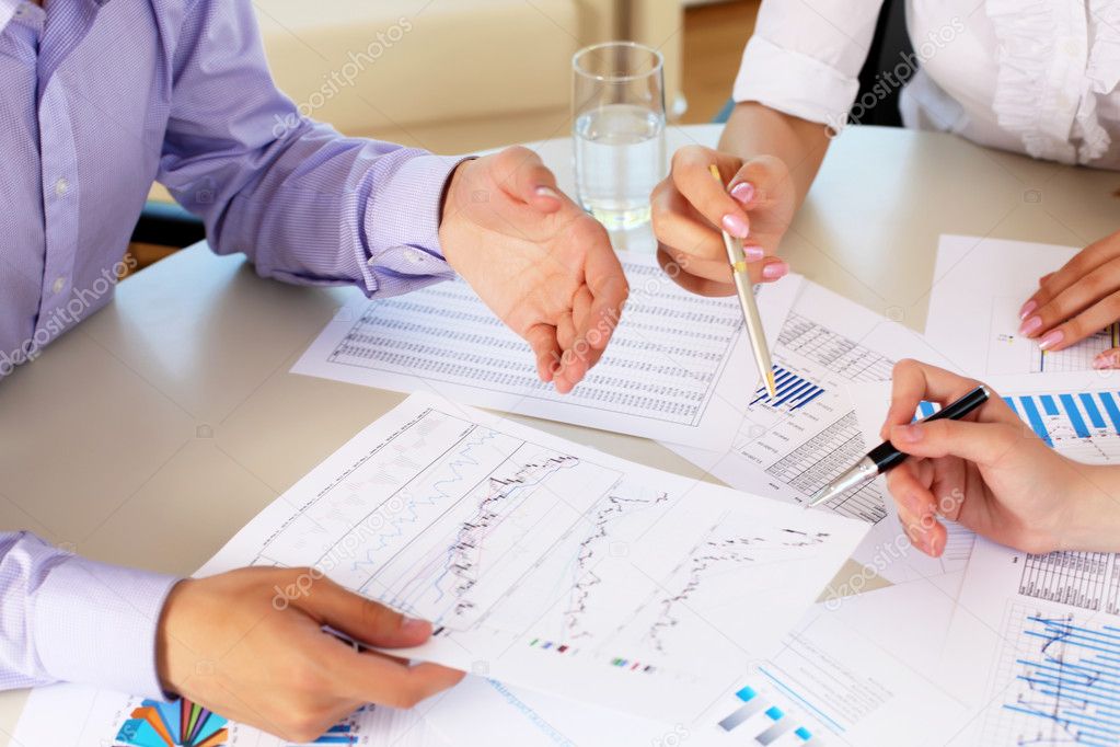 Financial and business documents on the table