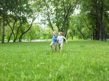 Portrait of two boys in the summer outdoors clipart