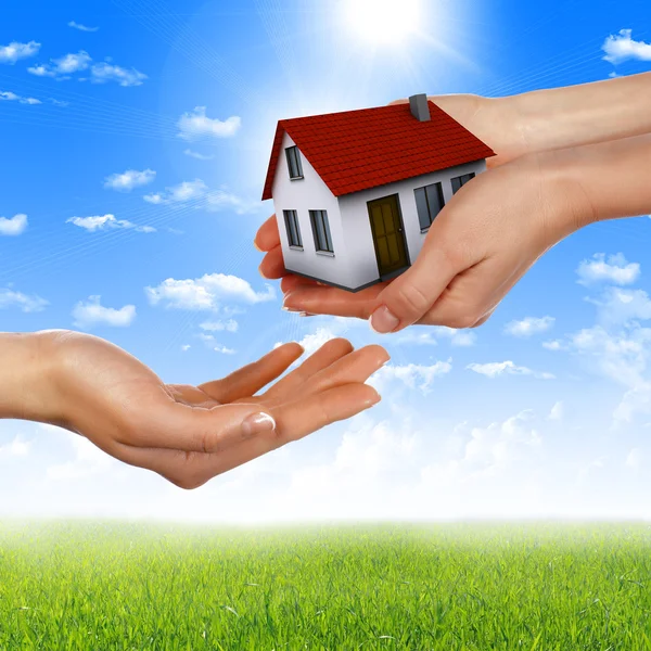 Hands holding house Stock Picture