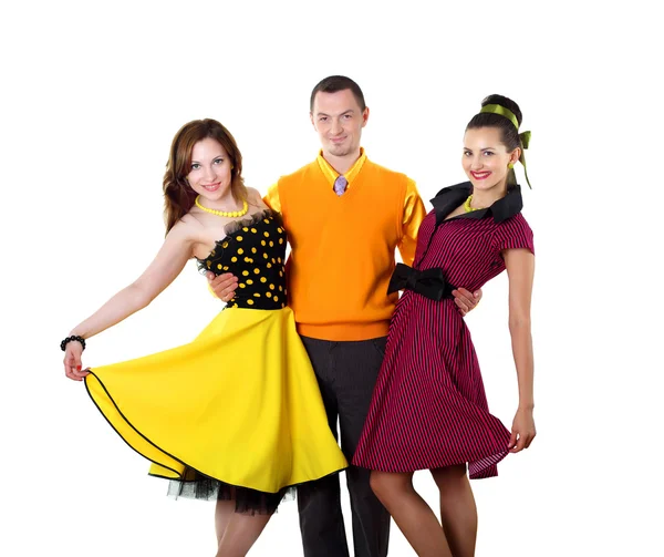 Young man with two women in bright colour wear — Stock Photo, Image