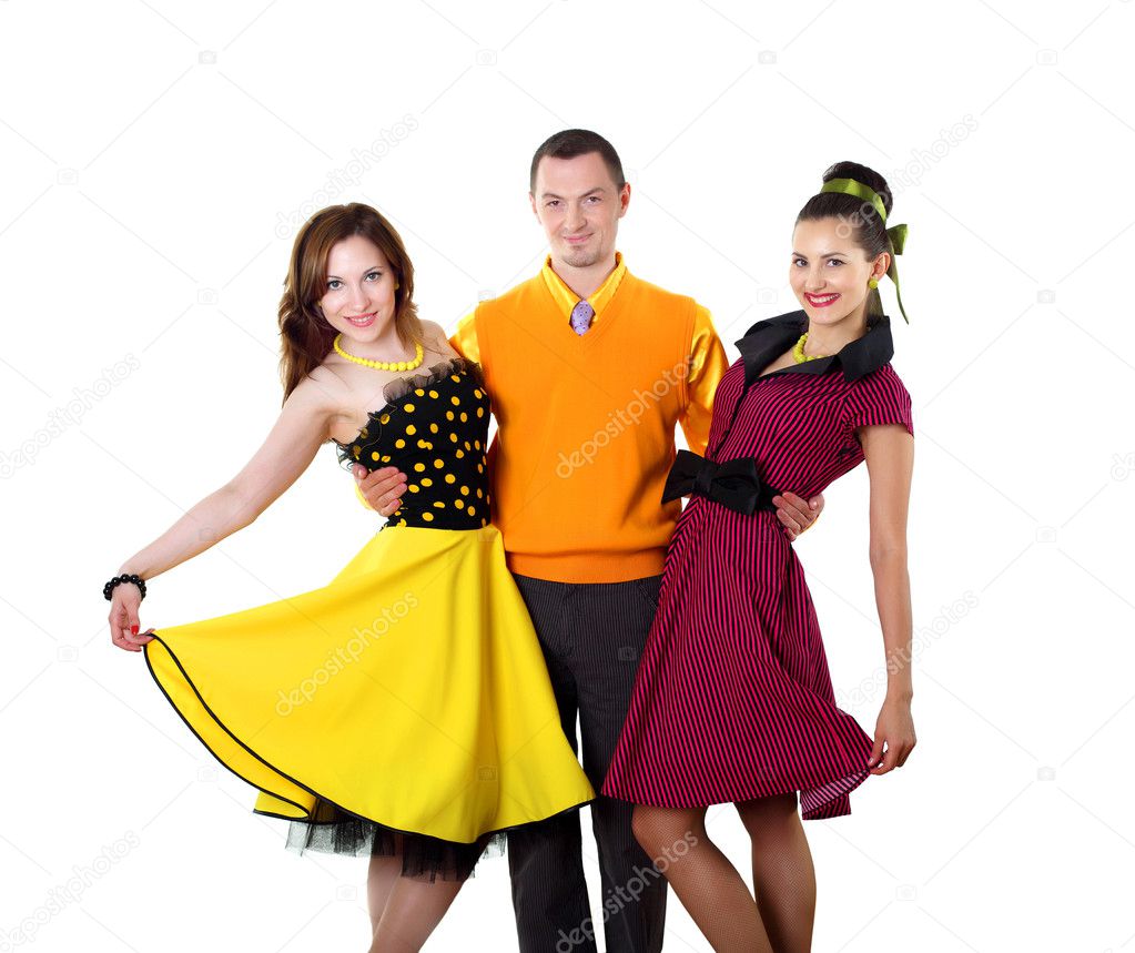 Young man with two women in bright colour wear