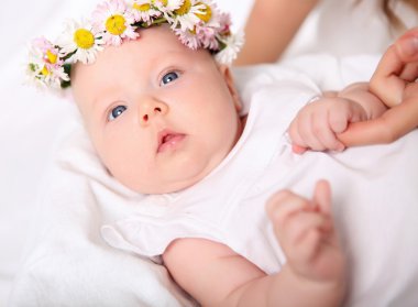 Portrait of a baby with a wreath clipart