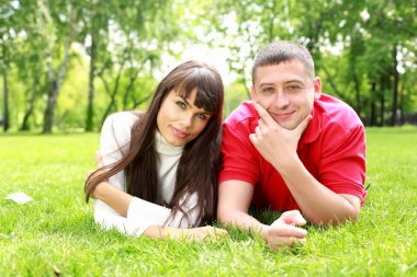 Young couple in the park clipart