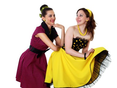 Two young woman in bright colour dresses clipart