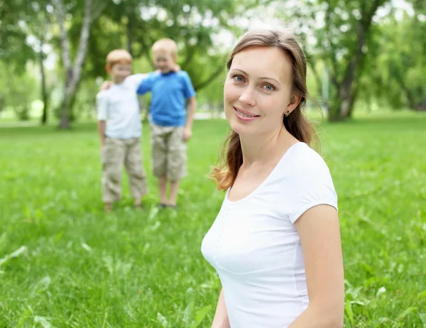 Portrait of mother with two sons on the background — Stock Photo, Image