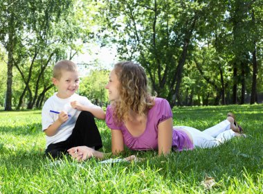 Mother with little son in the park