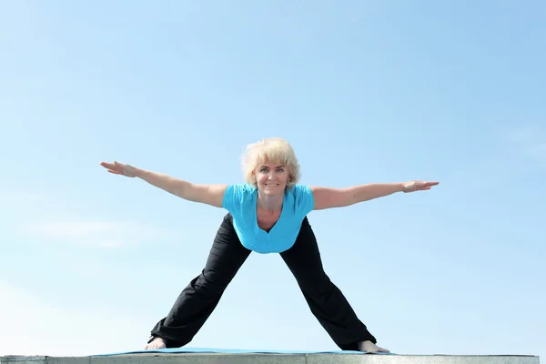 stock image Portrait of a senior woman doing yoga