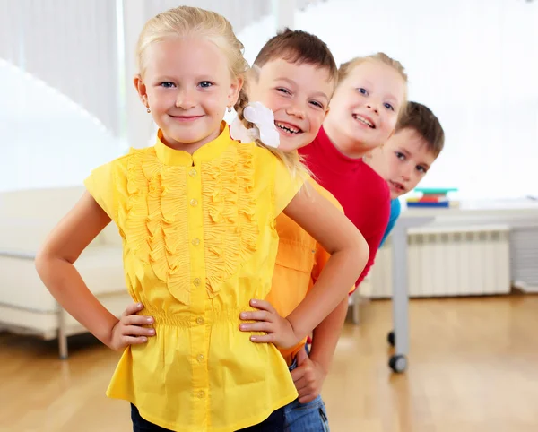 Group classmates standing in a row — Stock Photo, Image