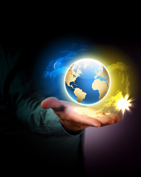 Man holding a glowing earth globe in his hands