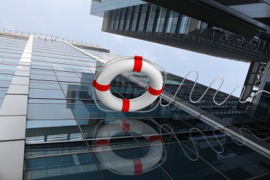 Rescue ring against skyscrapers clipart