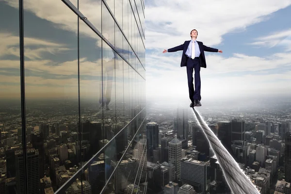 Business man balancing on the rope — Stock Photo, Image