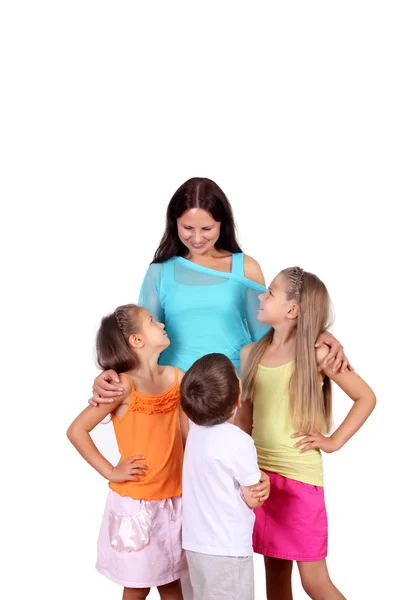 Mamma med hennes tre barn i studio — Stockfoto