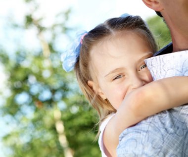 Father and daughter in the summer park