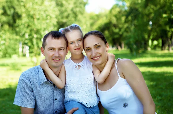 Family with two children in the summer park — Stock Photo, Image