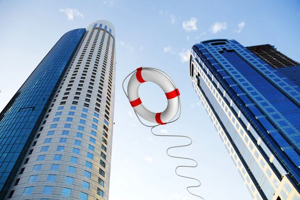 Rescue ring against skyscrapers — Stock Photo, Image
