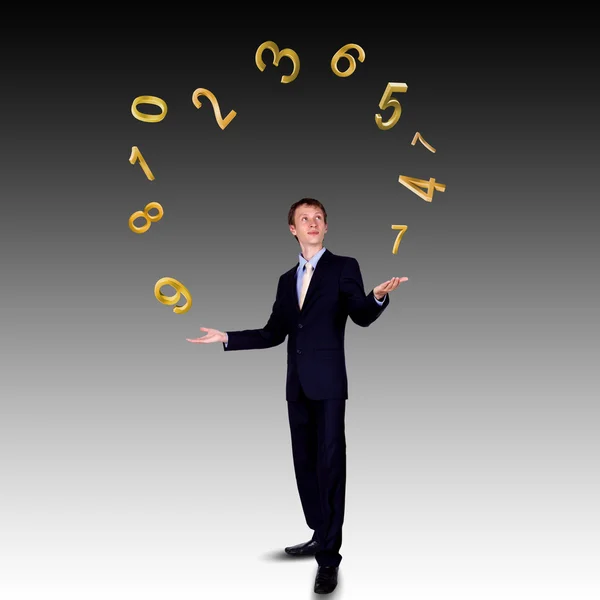 Homme d'affaires jonglant avec les chiffres et les symboles — Photo