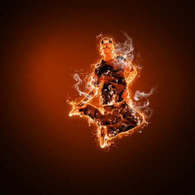 Fire dancer against black background clipart