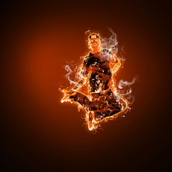 Tűz táncos fekete háttér ellenében — Stock Fotó