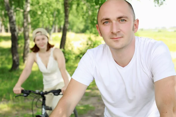 Young man riding a bike — Stock Photo, Image