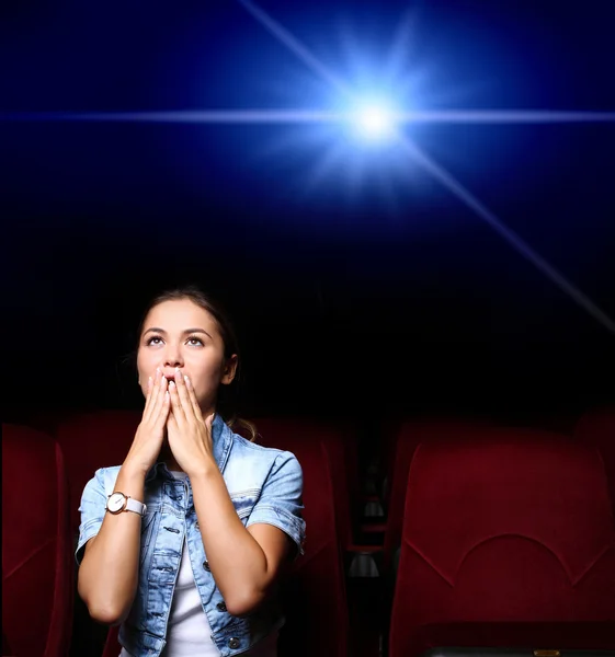 Young girl in cinema Stock Picture