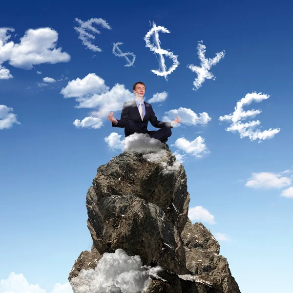 Businessman on the top of a high mountain — Stock Photo, Image