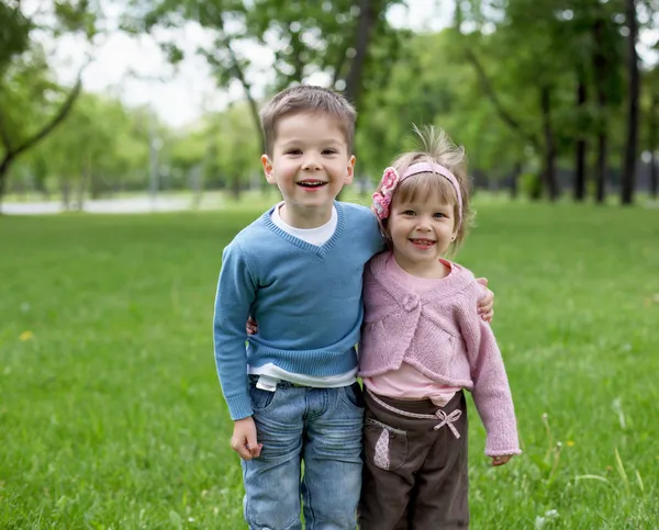 Happy sister and brother outdoors — Stock Photo, Image