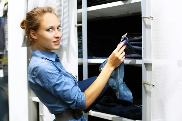 stock image Young girl buying clothes