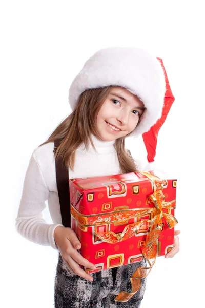 Mała dziewczynka kapelusz Świętego Mikołaja i Dar gospodarstwa — Zdjęcie stockowe