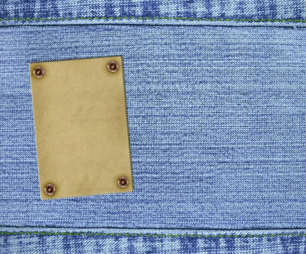 Fundo - jeans textura com etiqueta — Fotografia de Stock