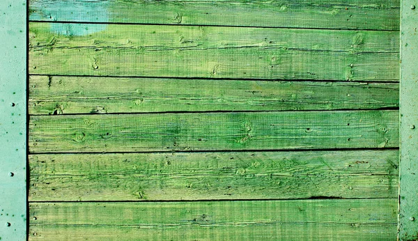 Pintura agrietada sobre una superficie de madera — Foto de Stock