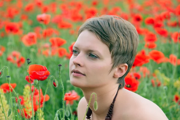 Girl in the poppies — Stock Photo, Image