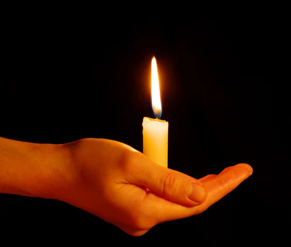 Candle in a hand Royalty Free Stock Images