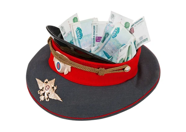 Polizeimütze mit Geld auf weißem Hintergrund — Stockfoto