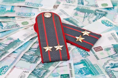 Shoulder strap of russian police on money background clipart