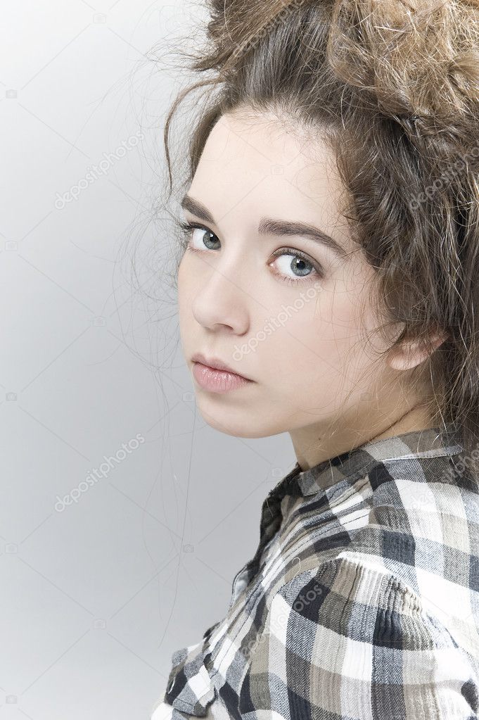 Portrait of a young girl turning back