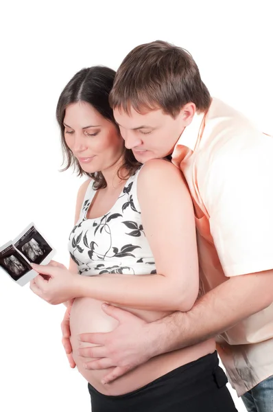 Couple holding a sonogram of their child — Stock Photo, Image