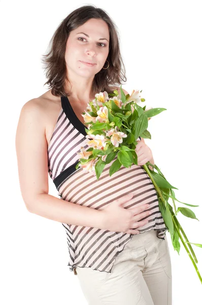 Portrait of pretty pregnant woman with flowers — Stock Photo, Image