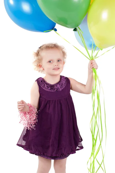 Menina bonito pouco com balões de ar multicoloridos — Fotografia de Stock