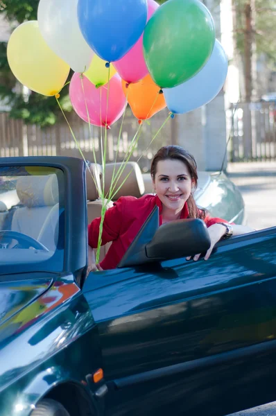 Beautiful brunette woman in car — Stock Photo, Image